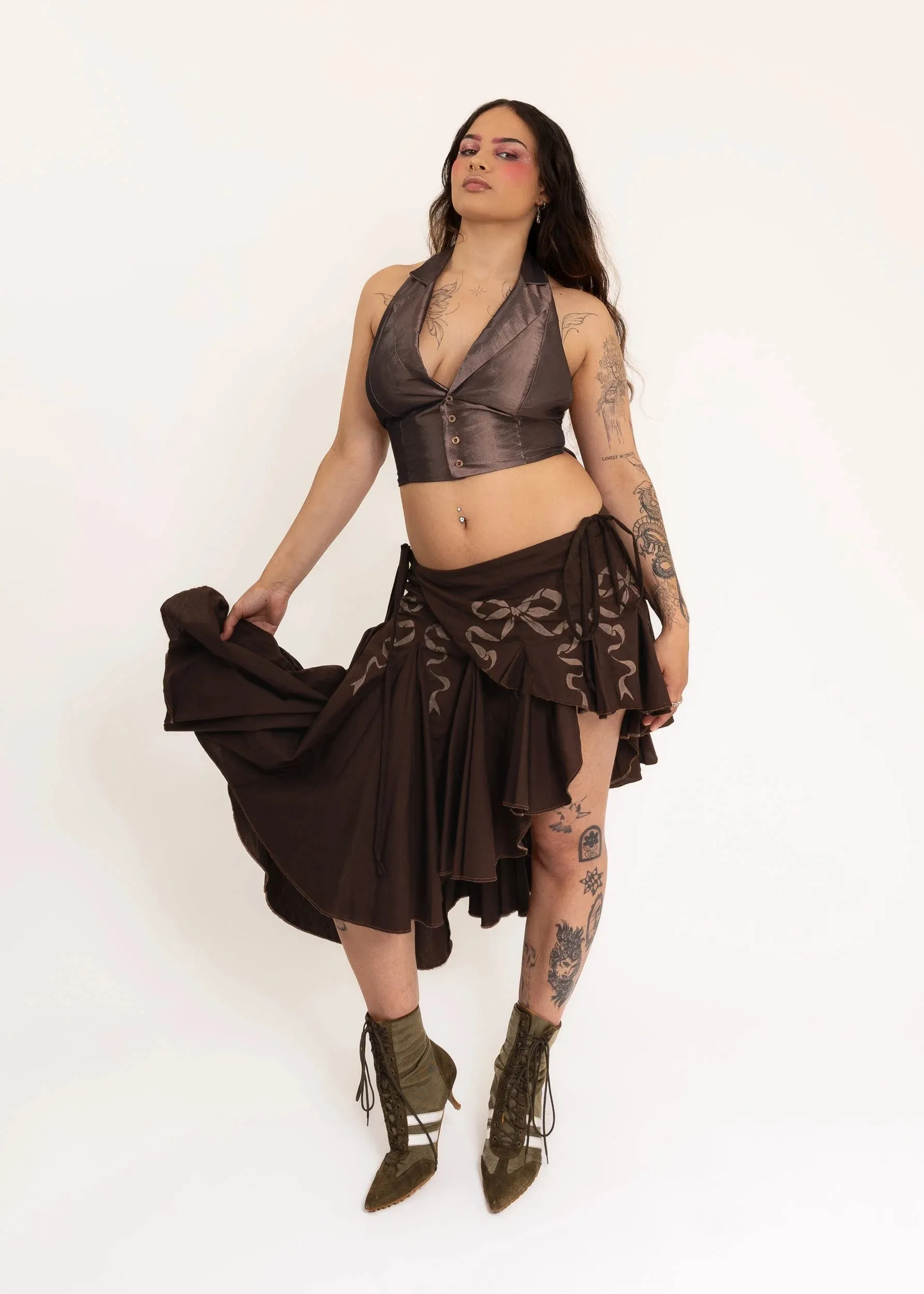 Asymmetric wrap skirt with hand-painted bow stencils