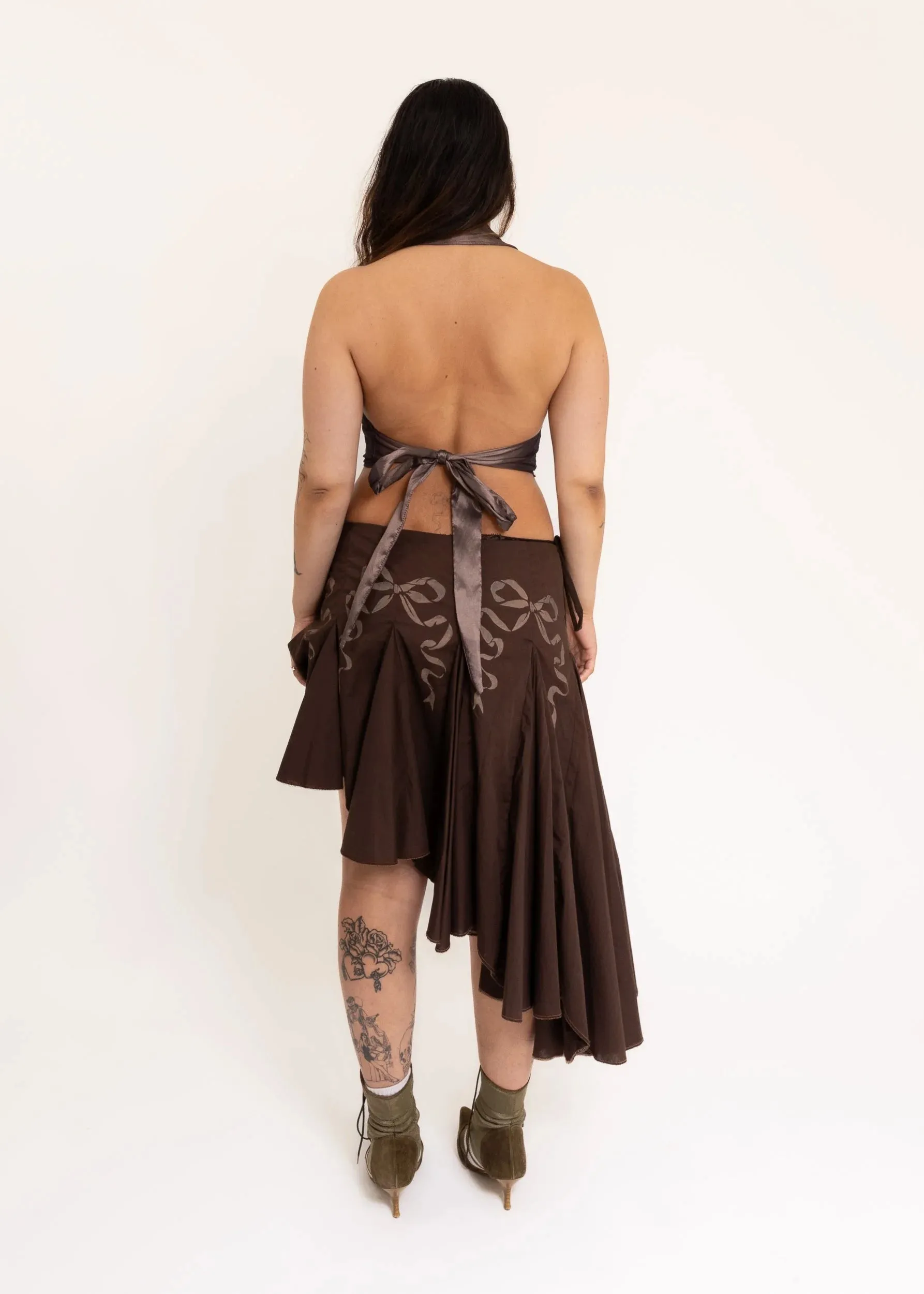 Asymmetric wrap skirt with hand-painted bow stencils