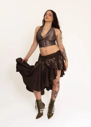 Asymmetric wrap skirt with hand-painted bow stencils