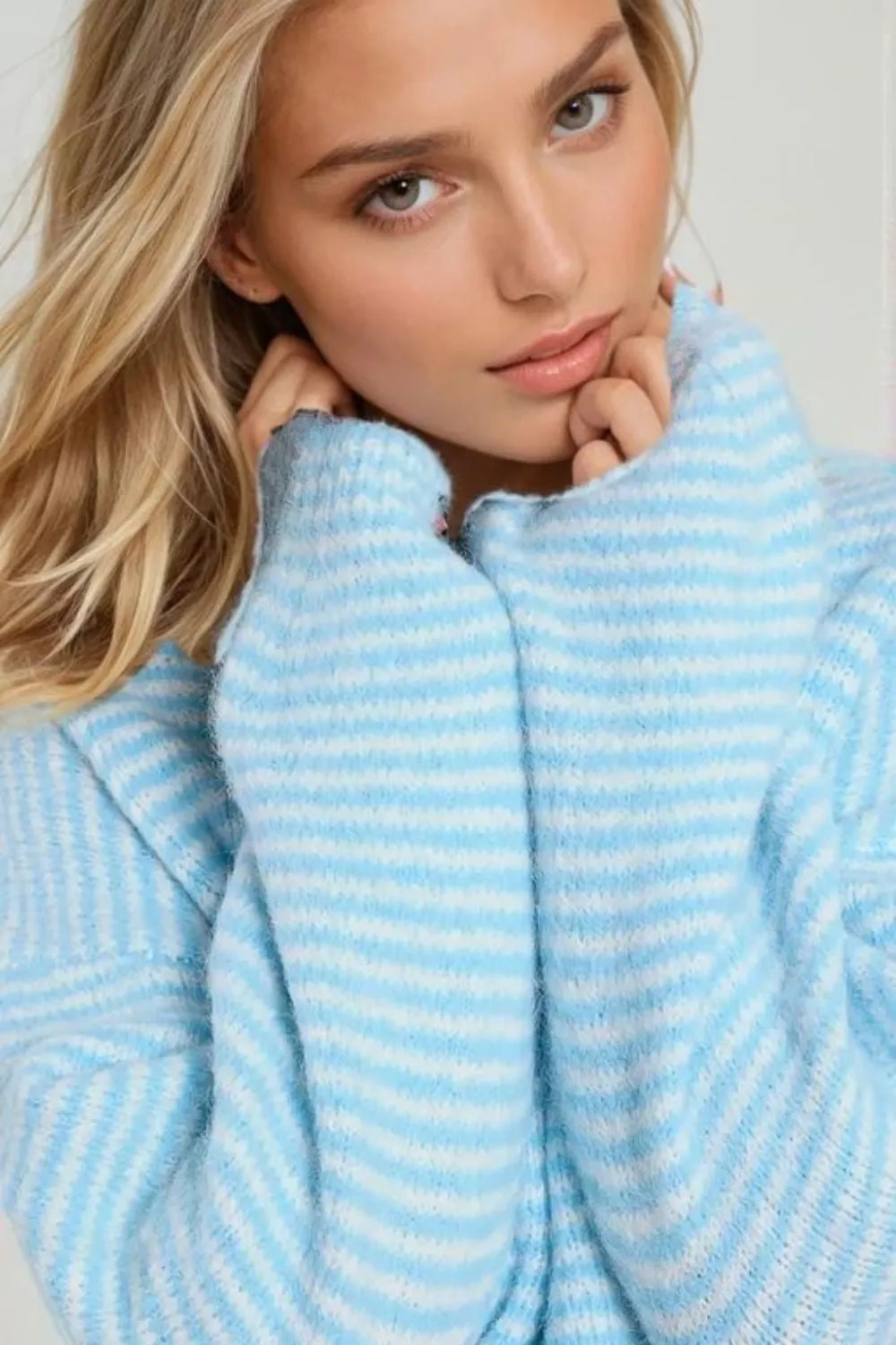 Fluffy striped sweater in baby blue