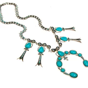 Silver tone necklace with pendant and turquoise