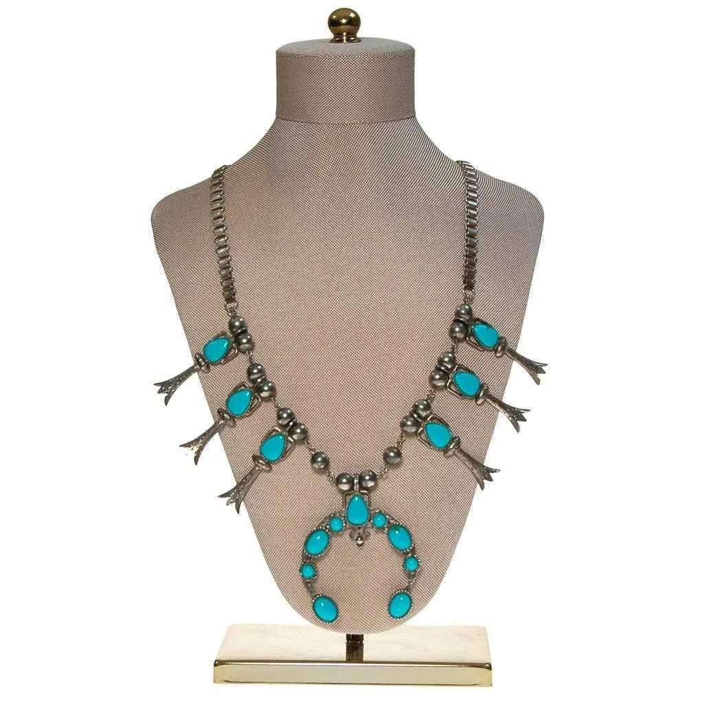 Silver tone necklace with pendant and turquoise