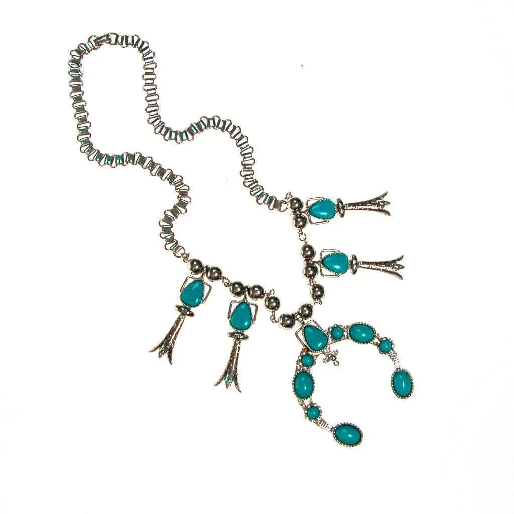 Silver tone necklace with pendant and turquoise