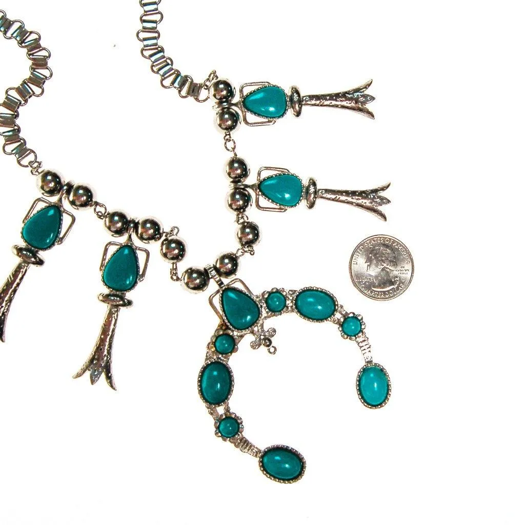 Silver tone necklace with pendant and turquoise